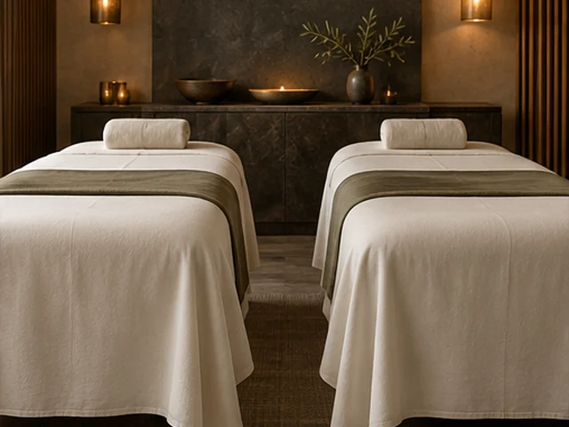 Illustrative couple massage setting with two adjacent ivory linen treatment beds